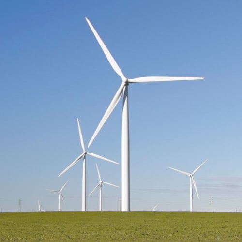 Wind farm towers in a field