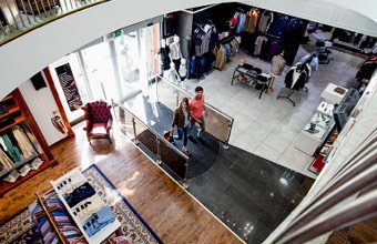 Shoppers entering a retail store with loss prevention sensors