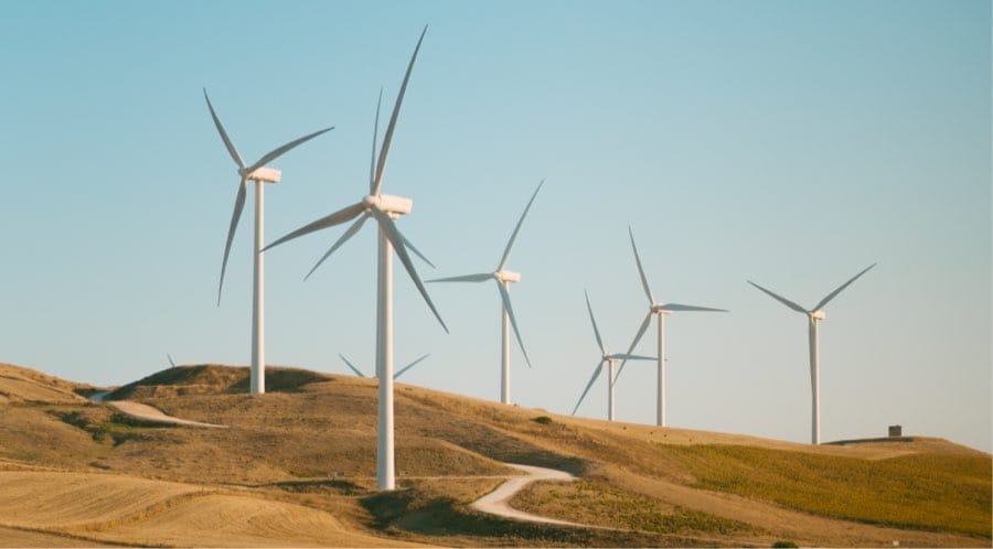 Wind turbines on a dry brown hill